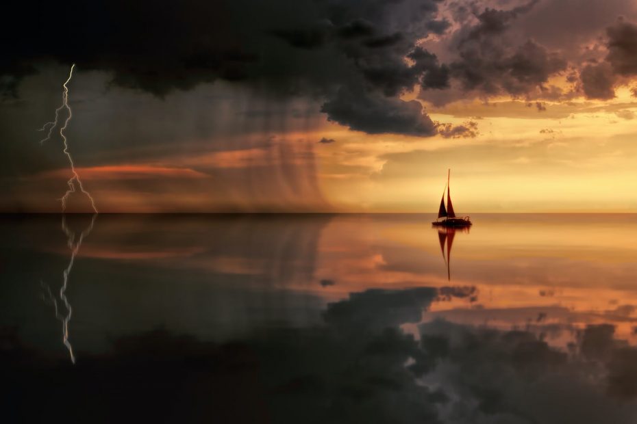 silhouette photography of boat on water during sunset