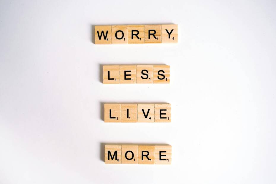 close up shot of scrabble tiles on a white surface